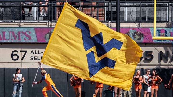 Oct 5, 2024; Stillwater, Oklahoma, USA; West Virginia Mountaineers flag is displayed after a field goal against the Oklahoma State Cowboys during the first quarter at Boone Pickens Stadium. Mandatory Credit: William Purnell-Imagn Images