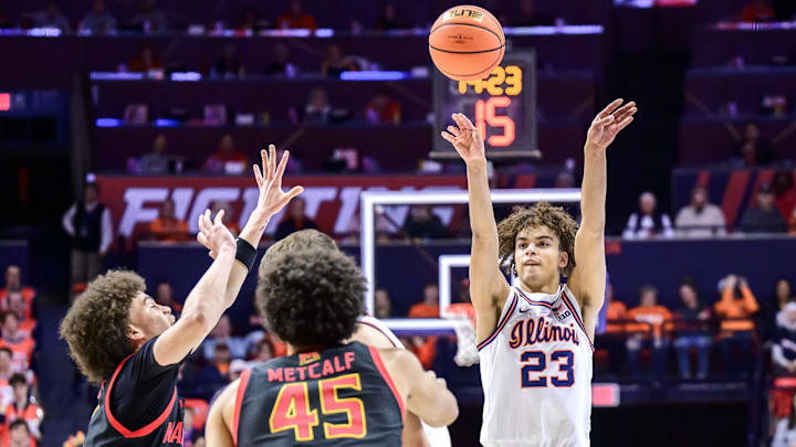 Jan 21, 2026; Champaign, Illinois, USA; Illinois Fighting Illini guard Keaton Wagler (23) shoots against Maryland Terrapins center Collin Metcalf (45) in the first half at State Farm Center. Mandatory Credit: Fred Zwicky-Imagn Images