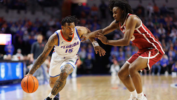 Feb 18, 2025; Gainesville, Florida, USA; Florida Gators guard Alijah Martin (15) drives past Oklahoma Sooners guard Duke Miles (15) during the second half at Exactech Arena at the Stephen C. O'Connell Center. Mandatory Credit: Matt Pendleton-Imagn Images