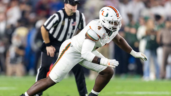 Jan 8, 2026; Glendale, AZ, USA; Miami Hurricanes defensive lineman Rueben Bain Jr. (4) against the Mississippi Rebels during the 2026 Fiesta Bowl and semifinal game of the College Football Playoff at State Farm Stadium. Mandatory Credit: Mark J. Rebilas-Imagn Images