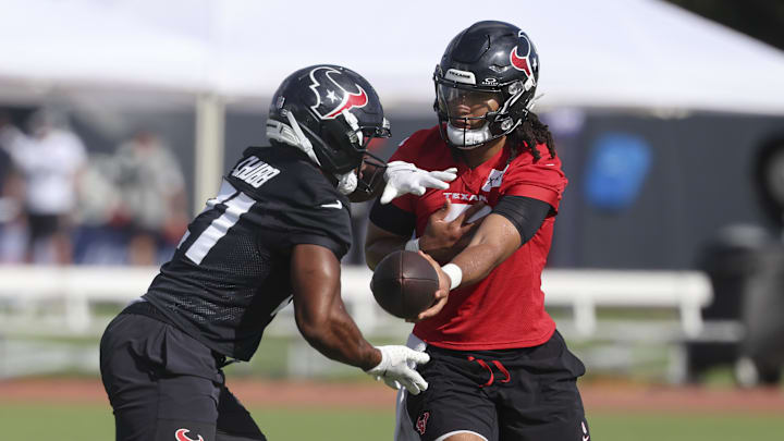Jul 24, 2025; Houston, TX, USA; Houston Texans quarterback C.J. Stroud (7) and running back Nick Chubb (21) during training camp at Houston Methodist Training Center. Mandatory Credit: Troy Taormina-Imagn Images