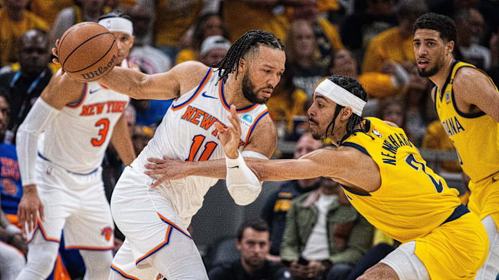 May 17, 2024; Indianapolis, Indiana, USA; New York Knicks guard Jalen Brunson (11) dribbles the ball while Indiana Pacers guard Andrew Nembhard (2) defends during game six of the second round for the 2024 NBA playoffs at Gainbridge Fieldhouse. Mandatory Credit: Trevor Ruszkowski-Imagn Images