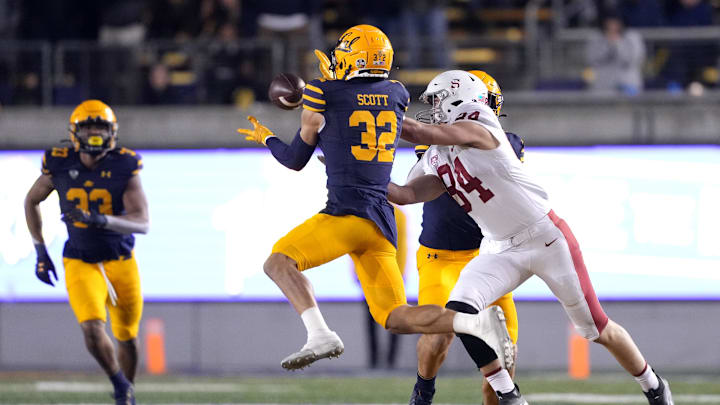 Nov 19, 2022; Berkeley, California, USA; California Golden Bears safety Daniel Scott (32) intercepts a pass intended for Stanford Cardinal tight end Benjamin Yurosek (84) during the fourth quarter at FTX Field at California Memorial Stadium. Mandatory Credit: Darren Yamashita-Imagn Images