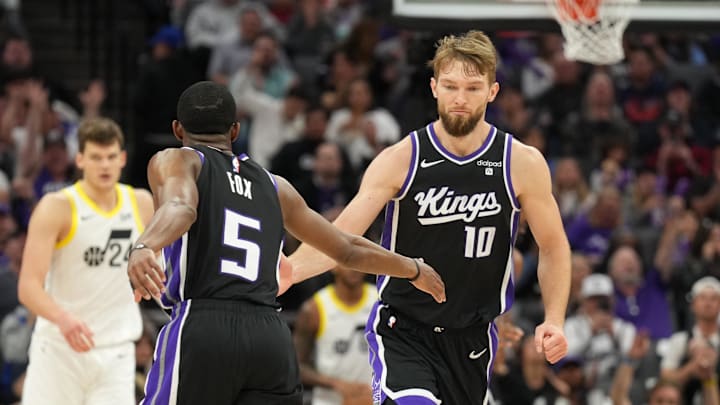 Mar 31, 2024; Sacramento, California, USA; Sacramento Kings guard De'Aaron Fox (5) is congratulated
