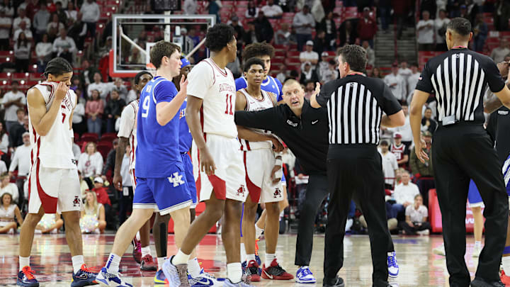 Jan 31, 2026; Fayetteville, Arkansas, USA; Kentucky Wildcats head coach Mark Pope separates players during the second half against the Arkansas Razorbacks at Bud Walton Arena. Kentucky won 85-77. Mandatory Credit: Nelson Chenault-Imagn Images