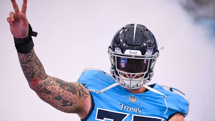 Jan 2, 2022; Nashville, Tennessee, USA;  Tennessee Titans offensive tackle Taylor Lewan (77) against the Miami Dolphins during the first half at Nissan Stadium. Mandatory Credit: Steve Roberts-Imagn Images