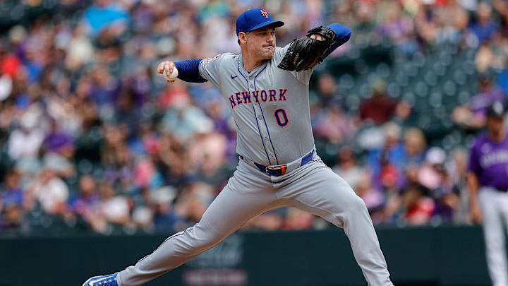 Aug 8, 2024; Denver, Colorado, USA; New York Mets relief pitcher Adam Ottavino (0) pitches in the sixth inning against the Colorado Rockies at Coors Field. Mandatory Credit: Isaiah J. Downing-Imagn Images