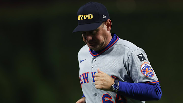 Sep 11, 2025; Philadelphia, Pennsylvania, USA; New York Mets manager Carlos Mendoza (64) jogs back to the dugout after a pitching change during the sixth inning against the Philadelphia Phillies at Citizens Bank Park. Mandatory Credit: Bill Streicher-Imagn Images
