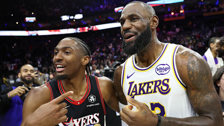 Dec 7, 2025; Philadelphia, Pennsylvania, USA; Los Angeles Lakers forward Lebron James (23) and Philadelphia 76ers guard Tyrese Maxey react with each other after the game at Xfinity Mobile Arena. Mandatory Credit: Bill Streicher-Imagn Images