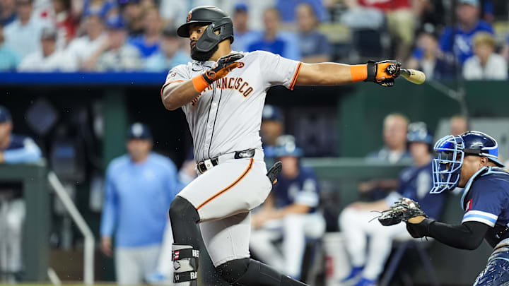 Sep 20, 2024; Kansas City, Missouri, USA; San Francisco Giants left fielder Heliot Ramos (17) hits an RBI single during the first inning against the Kansas City Royals at Kauffman Stadium.
