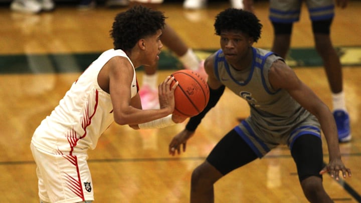 Newport sophomore Taylen Kinney passes the ball during the Ohio Valley Hoops Classic Dec. 1, 2023 at Mason's high school gymnasium.