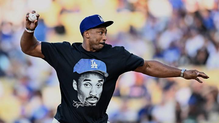 Jun 6, 2026; Los Angeles, California, USA; Los Angeles Rams defensive end Myles Garrett throws out the honorary first pitch before a game between the Los Angeles Angels and Los Angeles Dodgers at Dodger Stadium. Mandatory Credit: William Liang-Imagn Images Jun 6, 2026; Los Angeles, California, USA; Los Angeles Rams defensive end Myles Garrett throws out the honorary first pitch before a game between the Los Angeles Angels and Los Angeles Dodgers at Dodger Stadium. Mandatory Credit: William Liang-Imagn Images