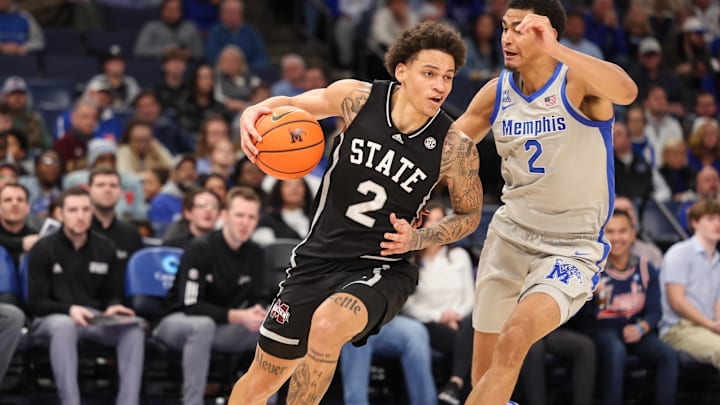 Dec 21, 2024; Memphis, Tennessee, USA; Mississippi State Bulldogs guard Riley Kugel (2) drives against Memphis Tigers forward Nicholas Jourdain (2) during the second half at FedExForum. Mandatory Credit: Wesley Hale-Imagn Images