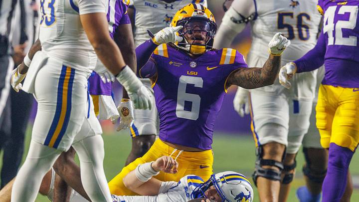 Oct 3, 2026; Baton Rouge, Louisiana, USA; LSU Tigers linebacker TJ Dottery (6) sacks McNeese Cowboys quarterback Jake Strong (4) during the first half at Tiger Stadium. Mandatory Credit: Stephen Lew-Imagn Images Oct 3, 2026; Baton Rouge, Louisiana, USA; LSU Tigers linebacker TJ Dottery (6) sacks McNeese Cowboys quarterback Jake Strong (4) during the first half at Tiger Stadium. Mandatory Credit: Stephen Lew-Imagn Images