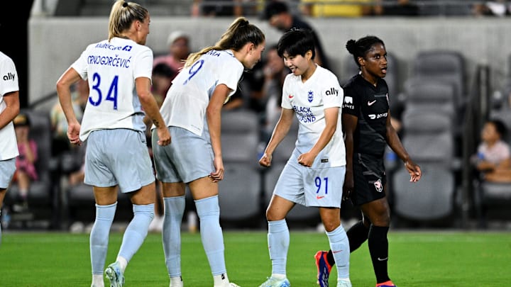Sep 6, 2024; Los Angeles, California, USA; Seattle Reign FC midfielder Ji So-Yun (91) celebrates with forward Jordyn Huitema (9) and forward Ana-Maria Crnogorcevic (34) after scoring during the first half against Angel City FC at BMO Stadium. Mandatory Credit: Kelvin Kuo-USA TODAY Sports