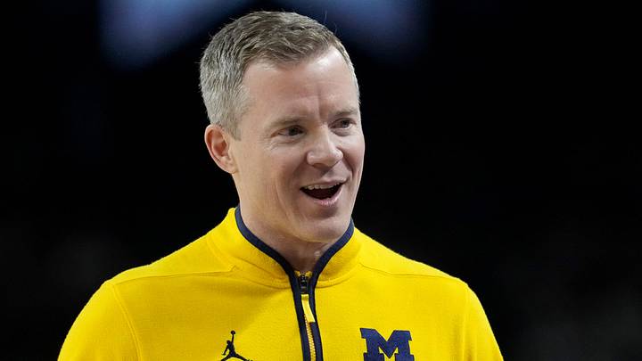 Michigan Wolverines head coach Dusty May talks with his team Monday, April 6, 2026, during the NCAA men's basketball tournament national championship game against the UConn Huskies at Lucas Oil Stadium in Indianapolis.