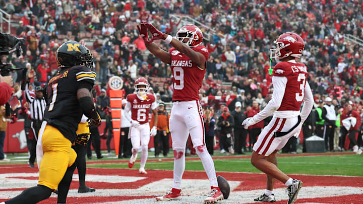 Nov 29, 2025; Fayetteville, Arkansas, USA; Arkansas Razorbacks wide receiver O’Mega Blake (9) celebrates after catching a pass for a touchdown during the first quarter against the Missouri Tigers at Donald W. Reynolds Razorback Stadium. Mandatory Credit: Nelson Chenault-Imagn Images Nov 29, 2025; Fayetteville, Arkansas, USA; Arkansas Razorbacks wide receiver O’Mega Blake (9) celebrates after catching a pass for a touchdown during the first quarter against the Missouri Tigers at Donald W. Reynolds Razorback Stadium. Mandatory Credit: Nelson Chenault-Imagn Images