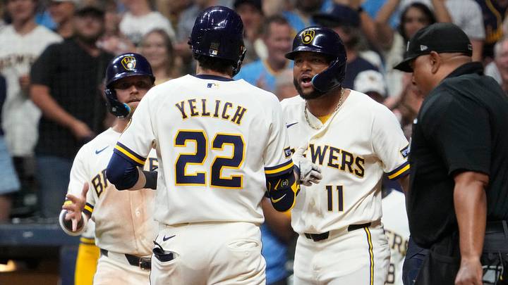 Aug 18, 2026; Milwaukee, Wisconsin, USA; Milwaukee Brewers designated hitter Christian Yelich (22) is congratulated by first baseman Jake Bauers (9) and Milwaukee Brewers left fielder Jackson Chourio (11) afterhitting a home run against the Seattle Mariners in the fifth inning at American Family Field. Mandatory Credit: Michael McLoone-Imagn Images