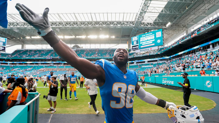 Los Angeles Chargers linebacker Odafe Oweh (98) celebrates with fans after the game 