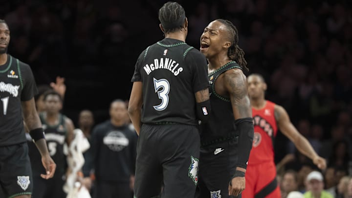 Mar 5, 2026; Minneapolis, Minnesota, USA; Minnesota Timberwolves forward Jaden McDaniels (3) and Minnesota Timberwolves guard Ayo Dosunmu (13) celebrate making a shot against the Toronto Raptors in the second half at Target Center.