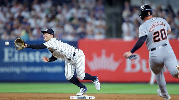 Jun 30, 2026; Bronx, New York, USA; New York Yankees shortstop Anthony Volpe (11) can't catch a throw from second baseman Jose Caballero (not pictured) on a ground ball by Detroit Tigers shortstop Zach McKinstry (not pictured) allowing Tigers first baseman Spencer Torkelson (20) to advance to third base during the sixth inning at Yankee Stadium. Mandatory Credit: Brad Penner-Imagn Images Jun 30, 2026; Bronx, New York, USA; New York Yankees shortstop Anthony Volpe (11) can't catch a throw from second baseman Jose Caballero (not pictured) on a ground ball by Detroit Tigers shortstop Zach McKinstry (not pictured) allowing Tigers first baseman Spencer Torkelson (20) to advance to third base during the sixth inning at Yankee Stadium. Mandatory Credit: Brad Penner-Imagn Images