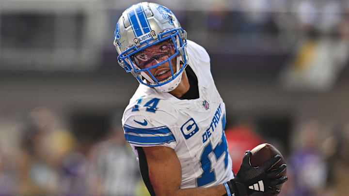 Oct 20, 2024; Minneapolis, Minnesota, USA; Detroit Lions wide receiver Amon-Ra St. Brown (14) reacts after catching a 35 yard touchdown pass from quarterback Jared Goff (not pictured) against the Minnesota Vikings the second quarter at U.S. Bank Stadium. Mandatory Credit: Jeffrey Becker-Imagn Images