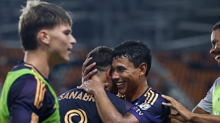 Sep 6, 2025; Houston, Texas, USA; Los Angeles Galaxy midfielder Lucas Sanabria (8) celebrates his goal with teammates against the Houston Dynamo FC  in the second half at Shell Energy Stadium. Mandatory Credit: Thomas Shea-Imagn Images