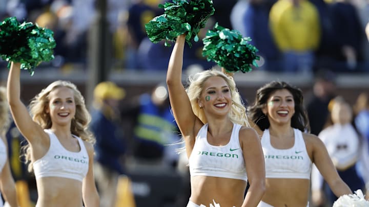 Nov 2, 2024; Ann Arbor, Michigan, USA;  Oregon Ducks cheerleaders celebrate after a score in the first half against the Michigan Wolverines at Michigan Stadium. 