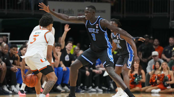 Feb 25, 2025; Coral Gables, Florida, USA; Duke Blue Devils center Khaman Maluach (9) defends Miami (Fl) Hurricanes guard Jalil Bethea (3) during the first half at Watsco Center. Feb 25, 2025; Coral Gables, Florida, USA; Duke Blue Devils center Khaman Maluach (9) defends Miami (Fl) Hurricanes guard Jalil Bethea (3) during the first half at Watsco Center.