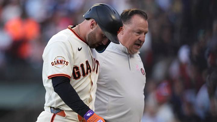 Jul 27, 2026; San Francisco, California, USA; San Francisco Giants third baseman Casey Schmitt (left) walks off the field with head of medical and performance Dave Groeschner (right) after suffering an injury during the second inning against the Milwaukee Brewers at Oracle Park. Mandatory Credit: Darren Yamashita-Imagn Images Jul 27, 2026; San Francisco, California, USA; San Francisco Giants third baseman Casey Schmitt (left) walks off the field with head of medical and performance Dave Groeschner (right) after suffering an injury during the second inning against the Milwaukee Brewers at Oracle Park. Mandatory Credit: Darren Yamashita-Imagn Images