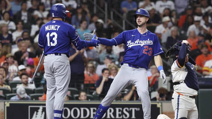 May 4, 2026; Houston, Texas, USA; Los Angeles Dodgers right fielder Kyle Tucker (23) celebrates with third baseman Max Muncy (13) after hitting a home run during the third inning against the Houston Astros at Daikin Park. Mandatory Credit: Troy Taormina-Imagn Images