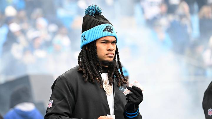 Carolina Panthers running back Jonathon Brooks (24) walk on to the field 