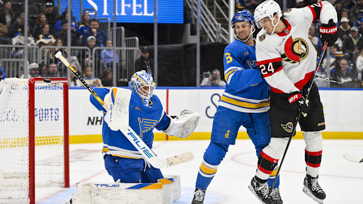 Nov 28, 2025; St. Louis, Missouri, USA; St. Louis Blues goaltender Jordan Binnington (50) and defenseman Philip Broberg (6) defend the net against Ottawa Senators center Dylan Cozens (24) during the third period at Enterprise Center. Mandatory Credit: Jeff Curry-Imagn Images Nov 28, 2025; St. Louis, Missouri, USA; St. Louis Blues goaltender Jordan Binnington (50) and defenseman Philip Broberg (6) defend the net against Ottawa Senators center Dylan Cozens (24) during the third period at Enterprise Center. Mandatory Credit: Jeff Curry-Imagn Images