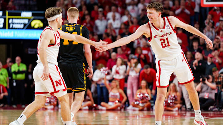 Pryce Sandfort and Sam Hoiberg high five after a shot during the second half against the Iowa Hawkeyes at Pinnacle Bank Arena. 