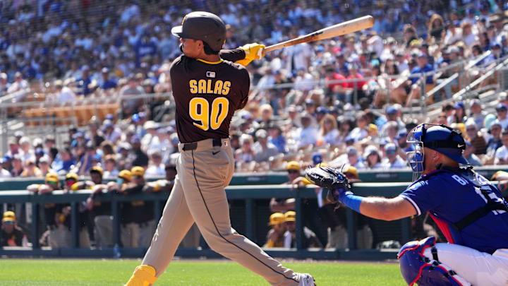 Feb 23, 2025; Phoenix, Arizona, USA; San Diego Padres catcher Ethan Salas (90) hits a double against the Los Angeles Dodgers during the second inning at Camelback Ranch-Glendale. Mandatory Credit: Joe Camporeale-Imagn Images Feb 23, 2025; Phoenix, Arizona, USA; San Diego Padres catcher Ethan Salas (90) hits a double against the Los Angeles Dodgers during the second inning at Camelback Ranch-Glendale. Mandatory Credit: Joe Camporeale-Imagn Images