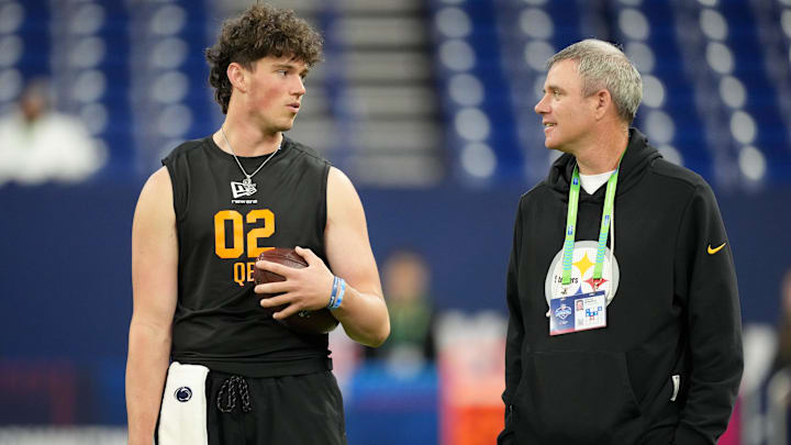 Penn State quarterback Drew Allar (QB02) speaks with Pittsburgh Steelers quarterbacks coach Tim Berbenich
