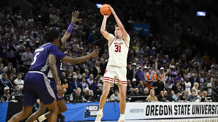 Mar 19, 2026; Portland, OR, USA; Wisconsin Badgers forward Nolan Winter (31) shoots against the High Point Panthers during the second half of a first round game of the men's 2026 NCAA Tournament at Moda Center. 