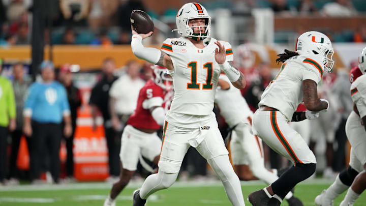 Jan 19, 2026; Miami Gardens, FL, USA; Miami Hurricanes quarterback Carson Beck (11) passes the ball against the Indiana Hoosiers during the first half of the College Football Playoff National Championship game at Hard Rock Stadium. Mandatory Credit: Kirby Lee-Imagn Images