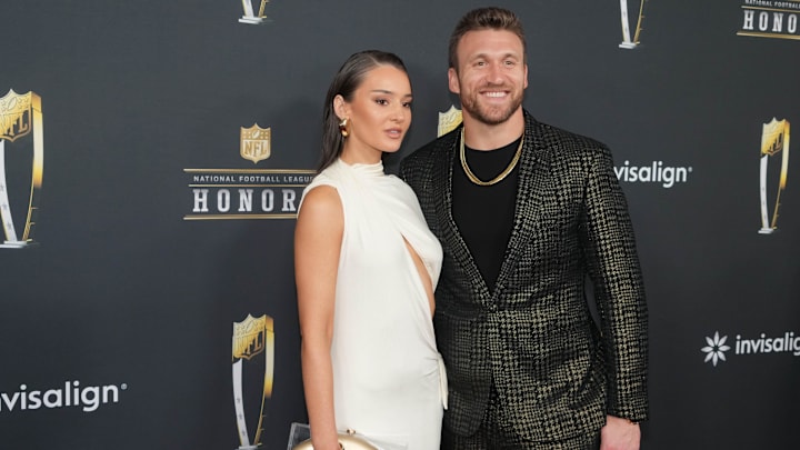 Kyle Juszczyk and his wife Kristin Juszczyk on the red carpet before Super Bowl LIX NFL Honors at Saenger Theatre.