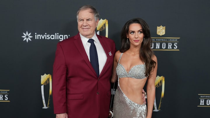 North Carolina head coach Bill Belichick and girlfriend Jordon Hudson on the red carpet before Super Bowl LIX NFL Honors.