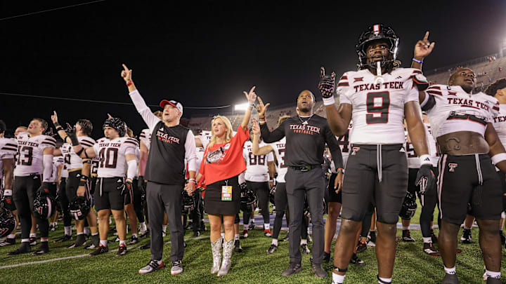 Oct 4, 2025; Houston, Texas, USA; Texas Tech Raiders head coach Joey McGuire and his wife Debbie McGuire sing the school song with the teams players after they defeated the Houston Cougars at TDECU Stadium. Mandatory Credit: Thomas Shea-Imagn Images