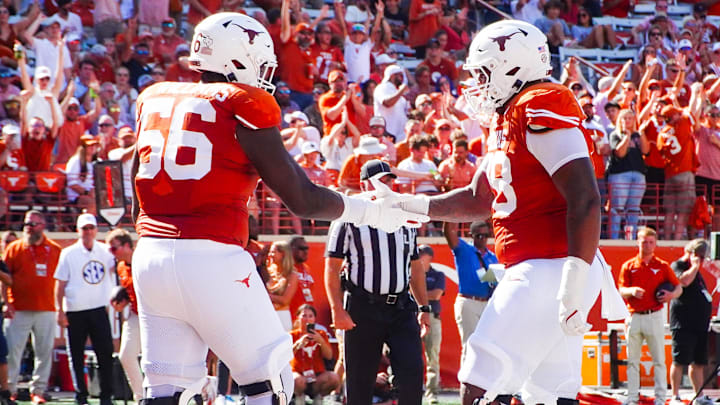 Aug 31, 2024; Austin, Texas, USA; Texas Longhorns lineman Cam WIlliams (56) and Kelvin Banks (78) celebrate in the end zone following a touchdown during the seond half of a game at Darrell K Royal-Texas Memorial Stadium. Mandatory Credit: Aaron Meullion-Imagn Images