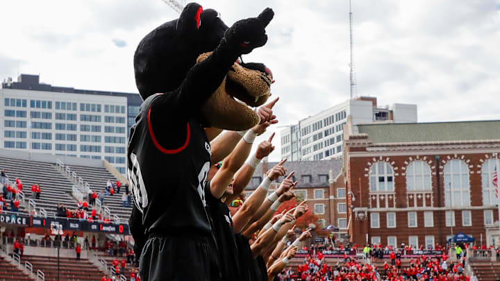 Oct 21, 2023; Cincinnati, Ohio, USA; The Cincinnati Bearcats mascot points to the sky during the playing of the alma mater before the game against the Baylor Bears at Nippert Stadium. Mandatory Credit: Katie Stratman-Imagn Images