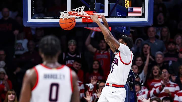 Arizona Wildcats guard KJ Lewis (5) throws down a dunk at McKale Center.