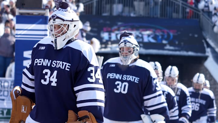 Penn State Nittany Lions hockey players walk to the rink for a game against the Michigan State Spartans at Beaver Stadium.