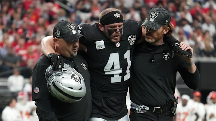 Oct 27, 2024; Paradise, Nevada, USA; Las Vegas Raiders linebacker Robert Spillane (41) is assisted off the field after an injury against the Kansas City Chiefs in the first half at Allegiant Stadium. Mandatory Credit: Kirby Lee-Imagn Images