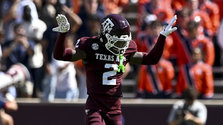 Sep 27, 2025; College Station, Texas, USA; Texas A&M Aggies cornerback Dezz Ricks (2) motions during the first half against the Auburn Tigers at Kyle Field. Mandatory Credit: Maria Lysaker-Imagn Images 