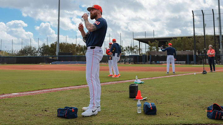 Houston Astros Pitcher Mike Burrows takes a drink of water from a bottle.