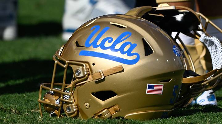 Nov 30, 2024; Pasadena, California, USA; UCLA Bruins helmets during pregame warmups before playing the Fresno State Bulldogs at Rose Bowl. Mandatory Credit: Robert Hanashiro-Imagn Images