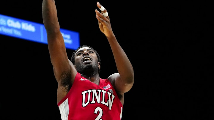 Nov 25, 2025; Las Vegas, Nevada, USA; UNLV Rebels forward Kimani Hamilton (2) shoots the ball in the second half against Alabama Crimson Tide in a 2025 Players Era Festival group play game at MGM Grand Garden Arena. Mandatory Credit: Stephen R. Sylvanie-Imagn Images
